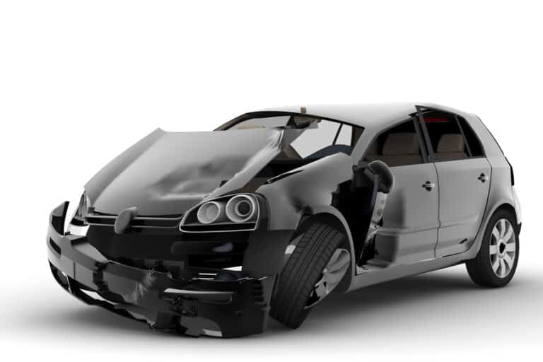 A black car with significant damage to the front and sides, including a wrinkled hood, a bent front wheel, and a broken driver's side door, is presented on a plain white background, ideal for brokerage or comparison services in Quebec.