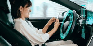 Autonomous driving with phone in hand.