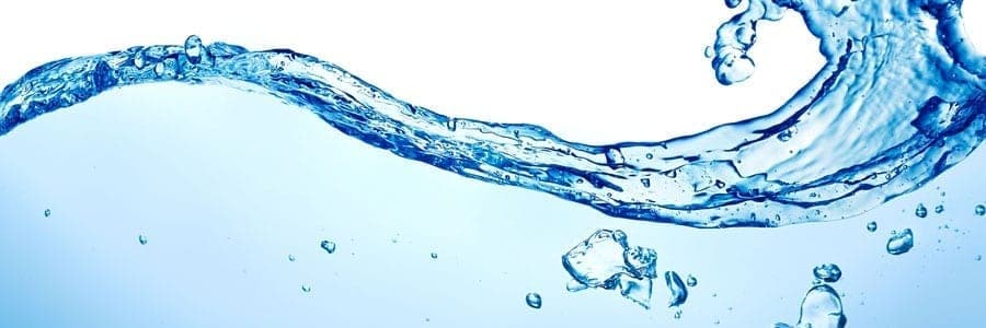 Flowing water with splashes and bubbles against a white and blue background.