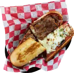 Delicious hot pizza sandwich with beef, cheese, and toppings on a toasted bun.