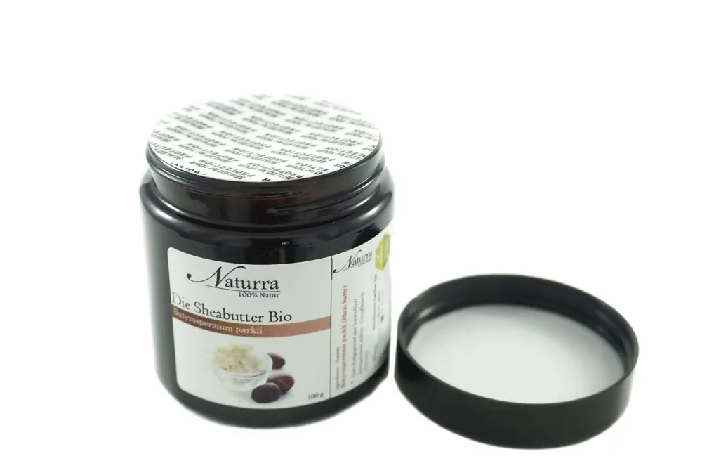 100g Bio Sheabutter unraffiniert und nativ im Braunglastiegel mit geöffnetem Deckel für natürliche Hautpflege und DIY-Kosmetik