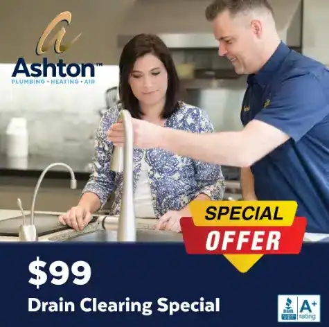 A plumber demonstrates a kitchen faucet to a woman. Text reads: $99 Drain Clearing Special, Ashton Plumbing Heating Air, Special Offer, and displays an A+ rating badge.
