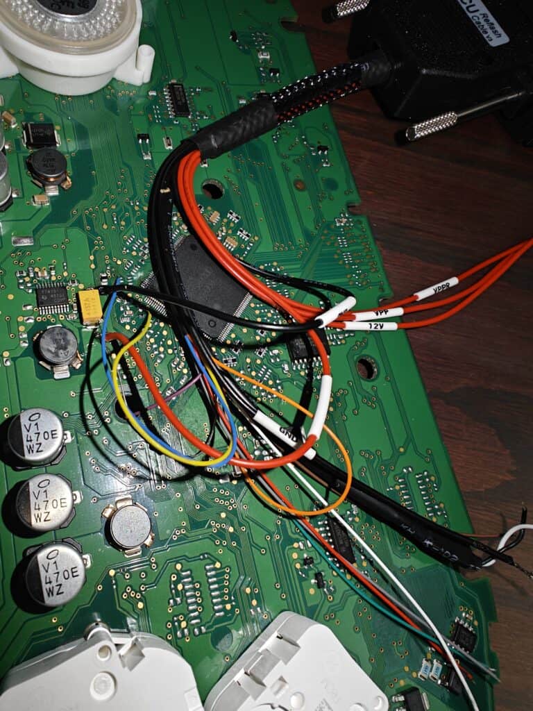 Wiring inside electronic lock system showing circuit board and connected wires.