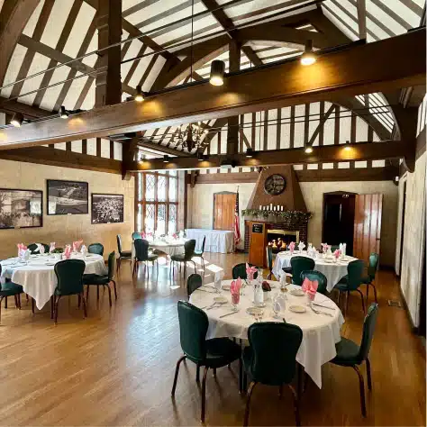 Elegant event space at Cascades Manor with rustic wooden beams and charming decor.