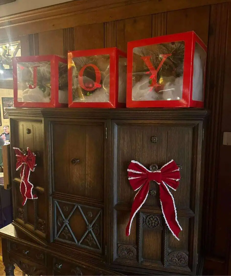 Holiday-themed Cascades Manor display with festive decorations.