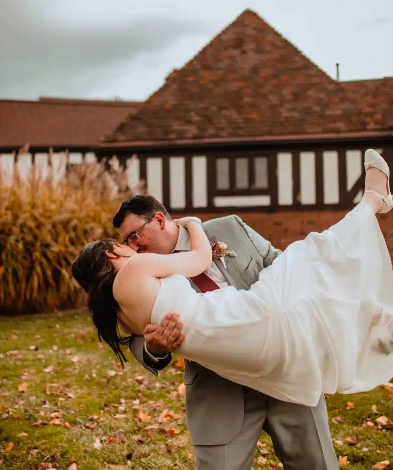 Wedding couple at Cascades Manor estate, romantic moment outdoors.
