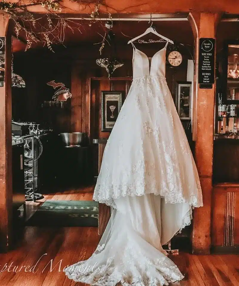 Elegant white wedding gown displayed at Cascades Manor venue.