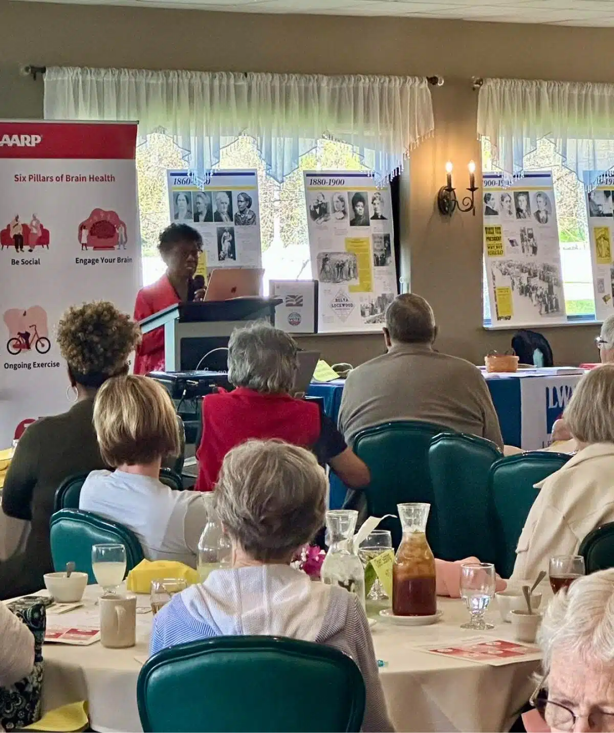 Elegant event venue at Cascades Manor with guests attending a presentation.