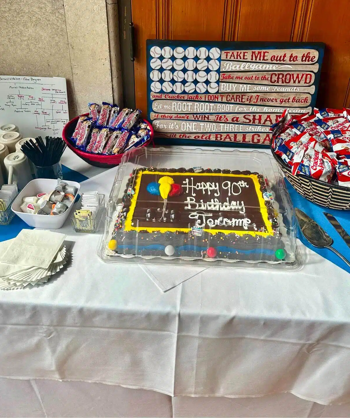 Birthday celebration with cake and candy at Cascades Manor event.