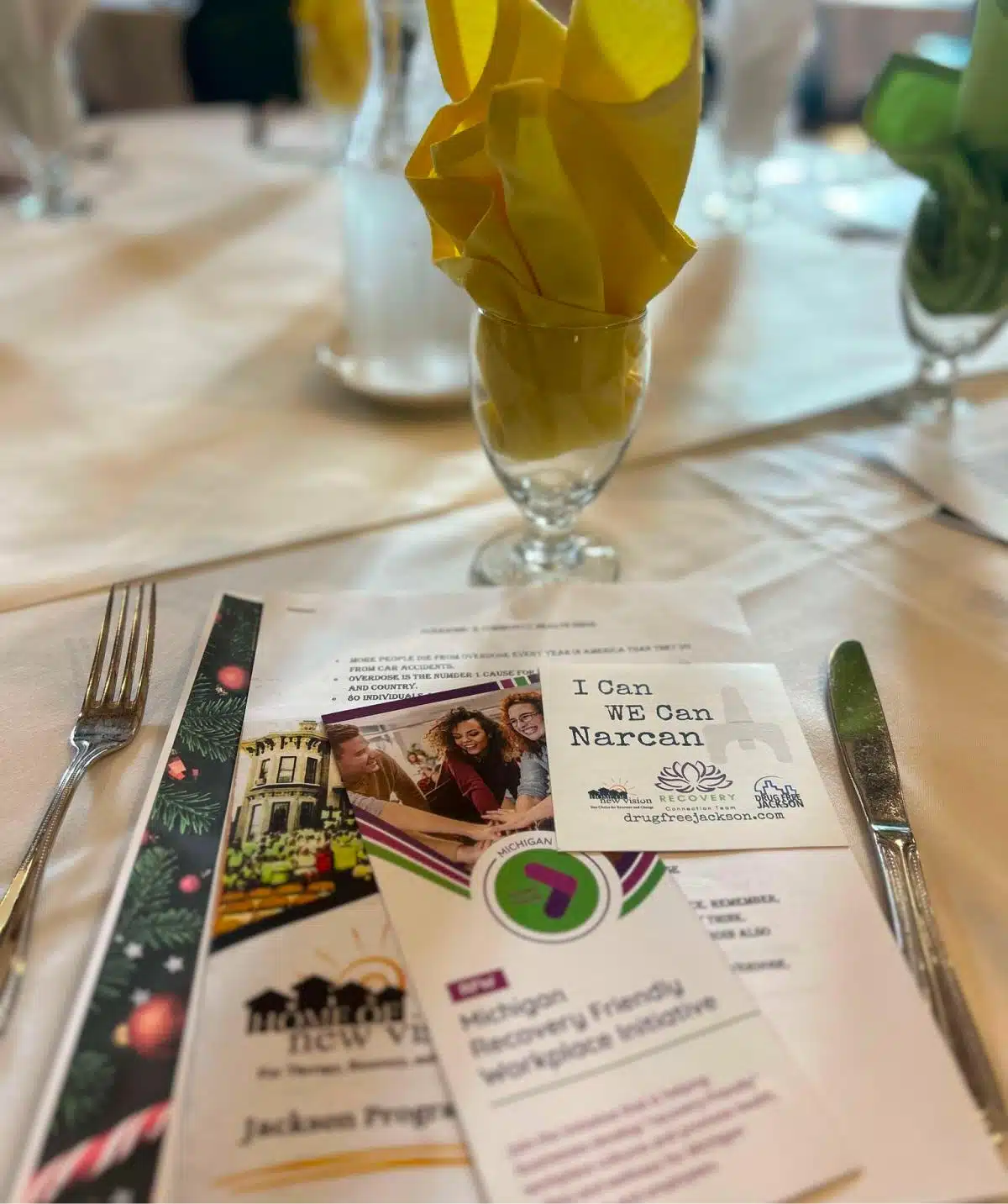 Elegant dining setup at Cascades Manor with colorful napkins and fine tableware.