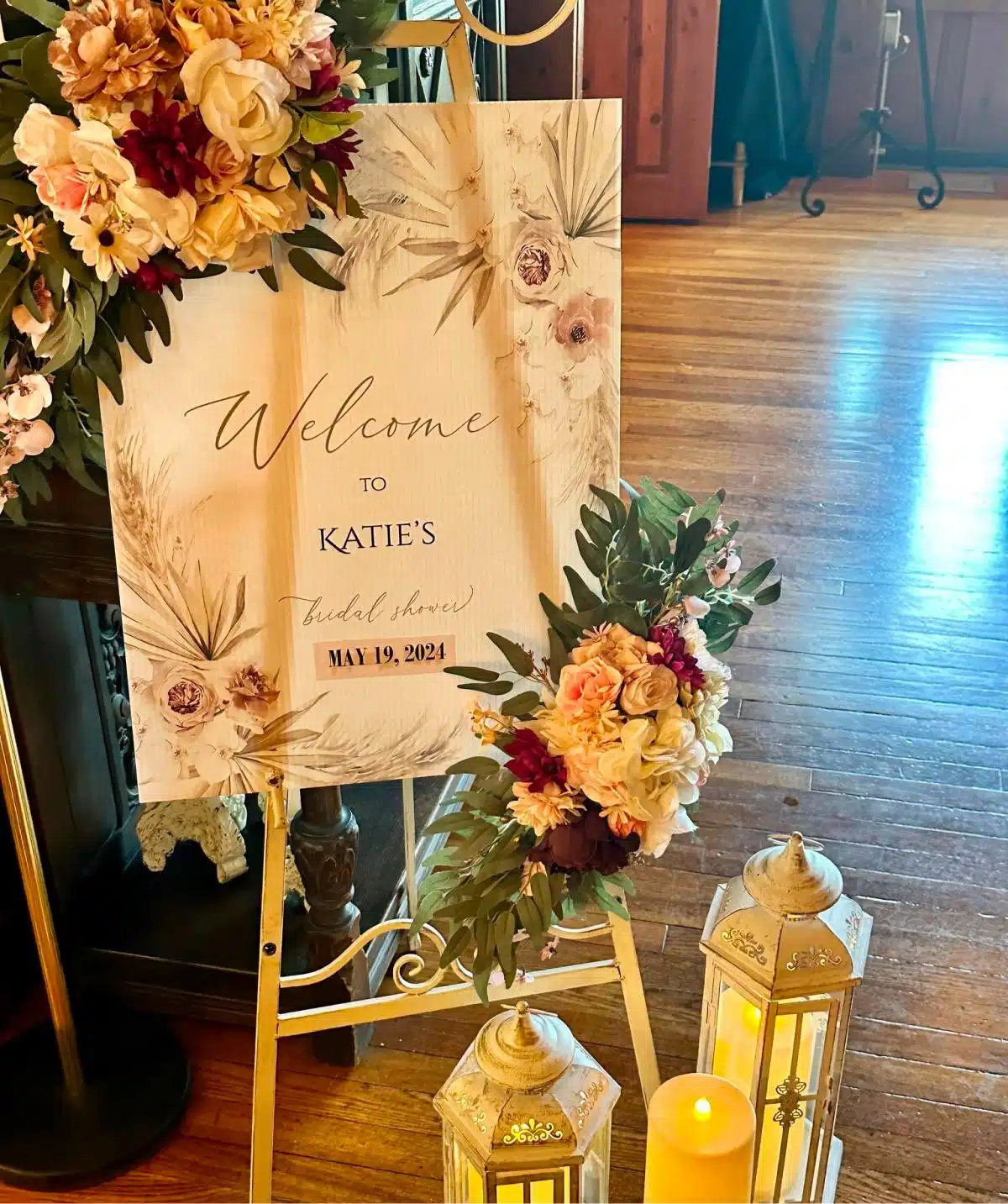 Welcome sign with floral decorations for wedding at Cascades Manor.