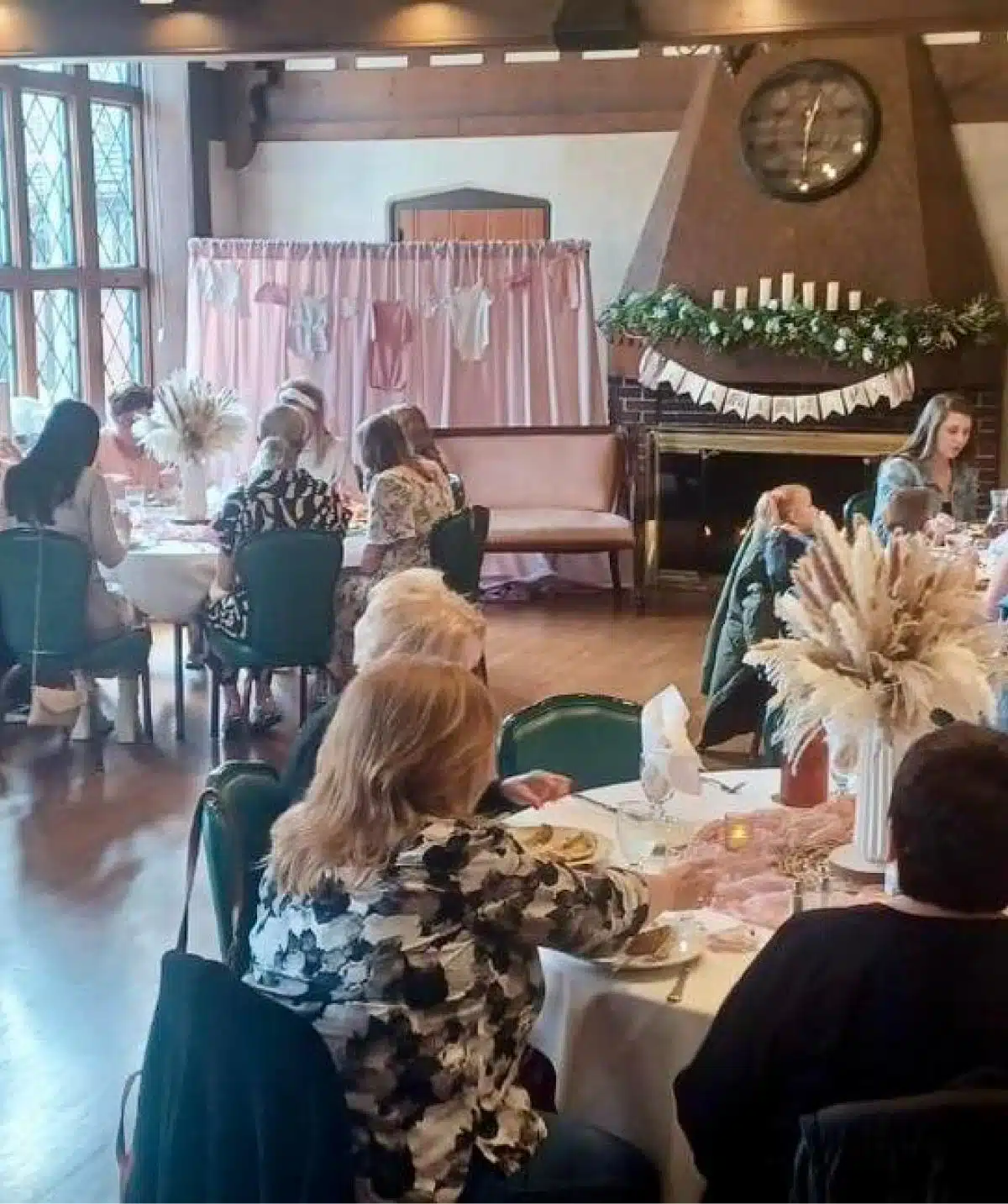 Elegant indoor event at Cascades Manor with guests dining and socializing in a cozy, stylish setting.