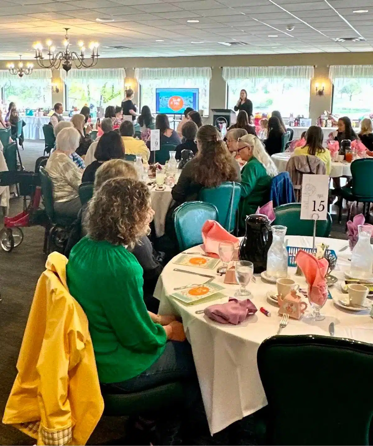 Elegant banquet hall at Cascades Manor hosting a large social event.
