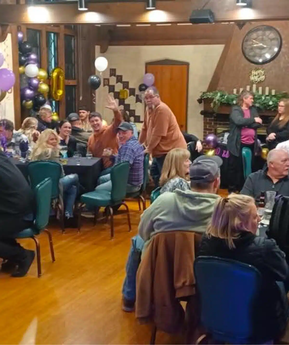 Group of people enjoying a celebration at Cascades Manor event venue.