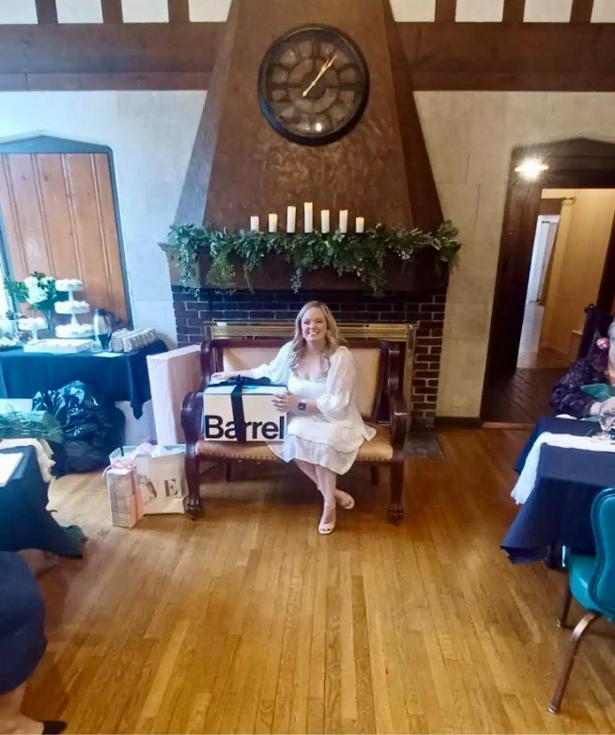 Fireplace with clock and greenery at Cascades Manor.