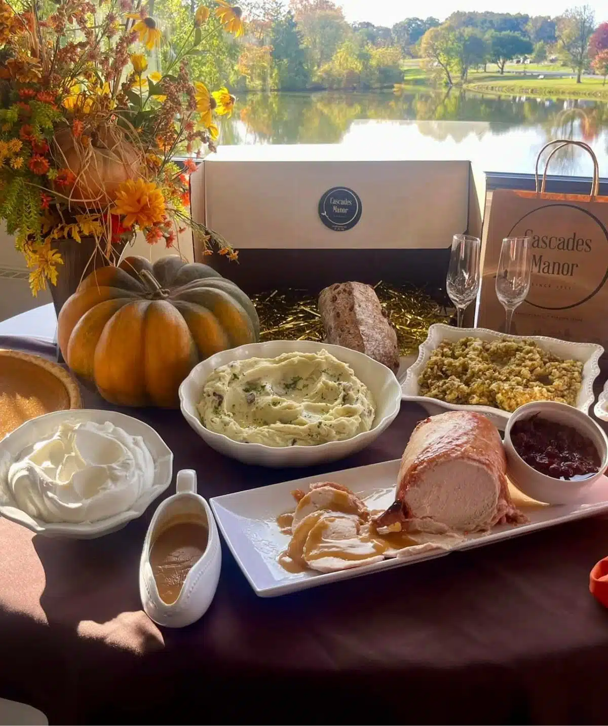 Festive Thanksgiving table with pumpkin, mashed potatoes, turkey, and desserts at Cascades Manor.