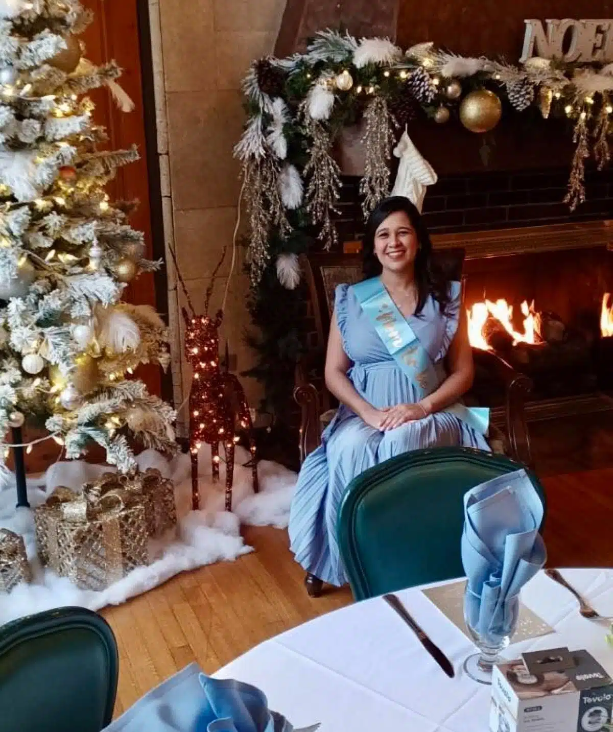 bridal shower photo shoot next to christmas tree and fire place