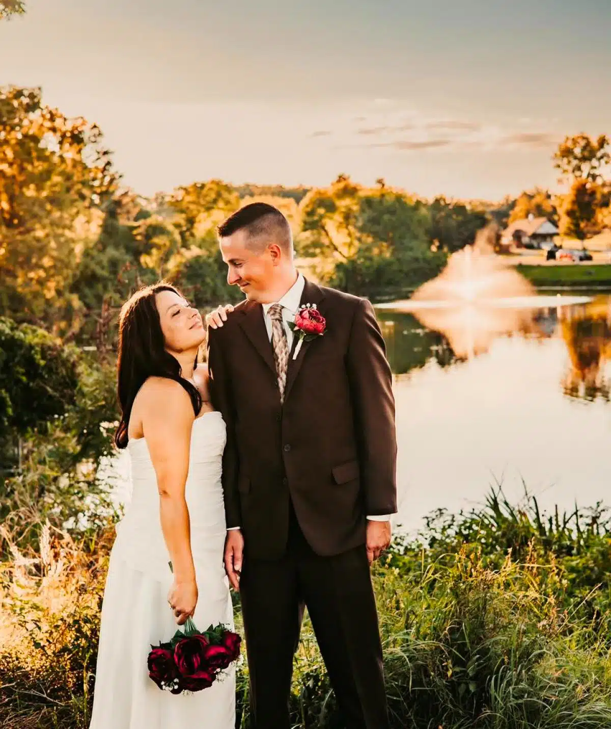 bride and groom photoshoot in front of pond