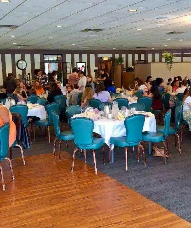 Banquet hall at Cascades Manor with guests dining and socializing.