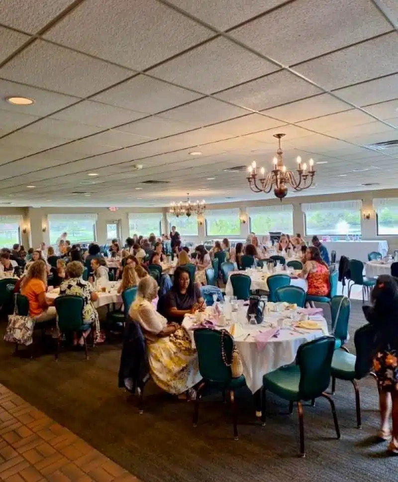 Elegant event at Cascades Manor with guests dining and socializing.