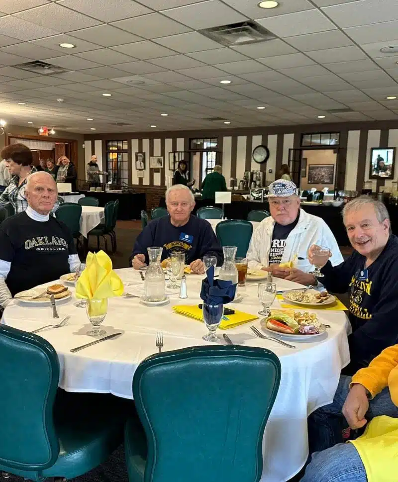 Group of seniors enjoying a meal at Cascades Manor restaurant.