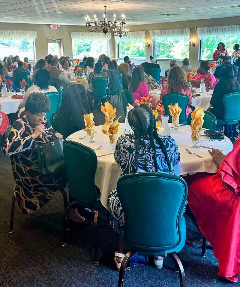 Cascades Manor event space hosting a large, elegant gathering with guests seated at round tables.