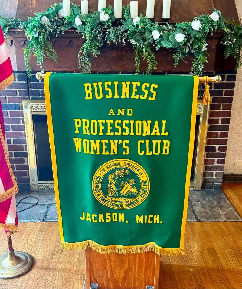 Business and Women's Club banner at Cascades Manor event.