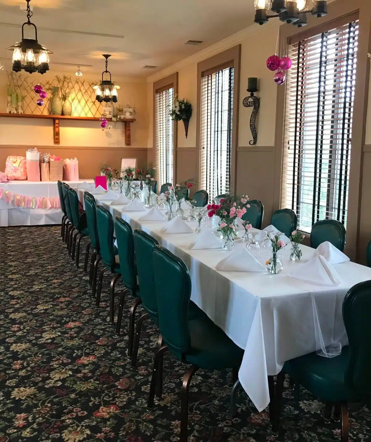 tables decorated with flowers for baby shower