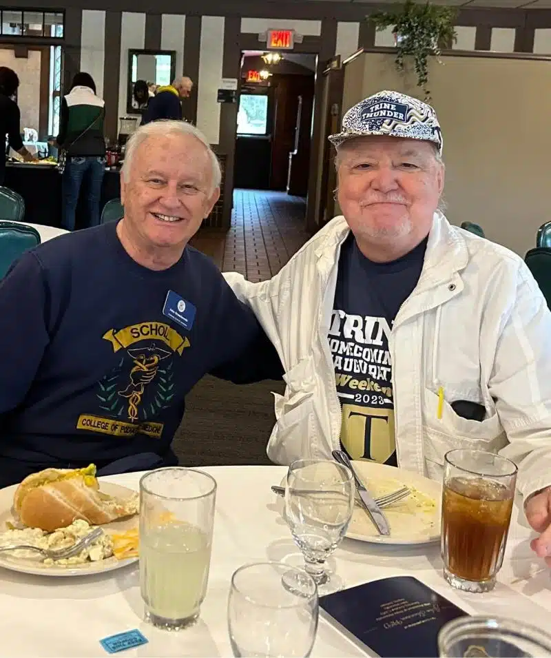 Two men enjoying a meal at Cascades Manor restaurant.
