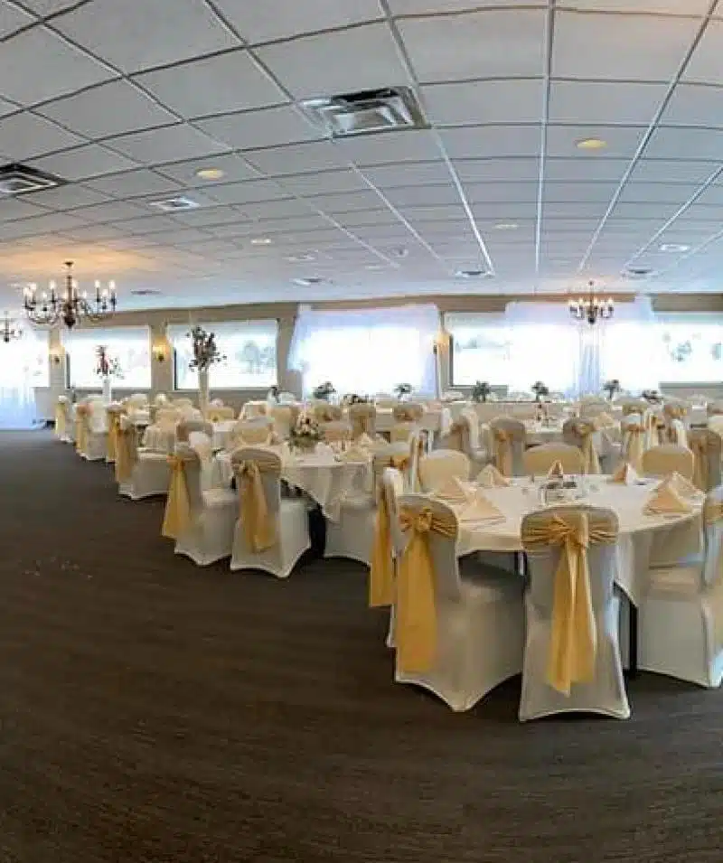 white table and chairs with yellow bows