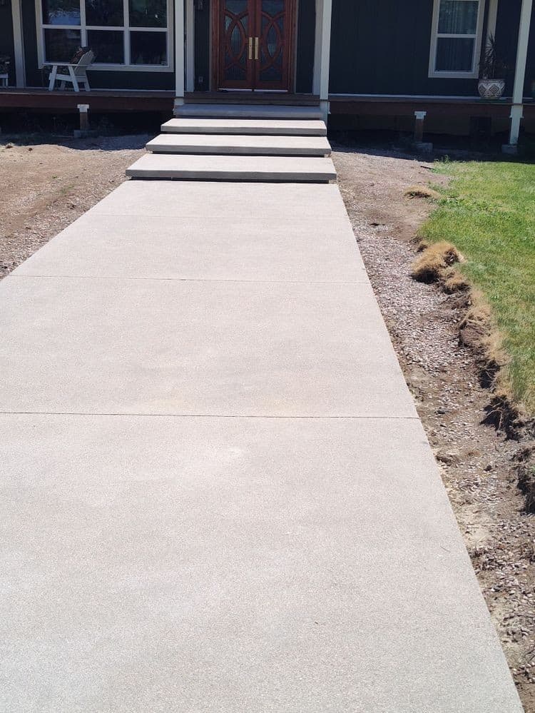 Front entry concrete walkway Colorado Springs - welcoming pathway to home