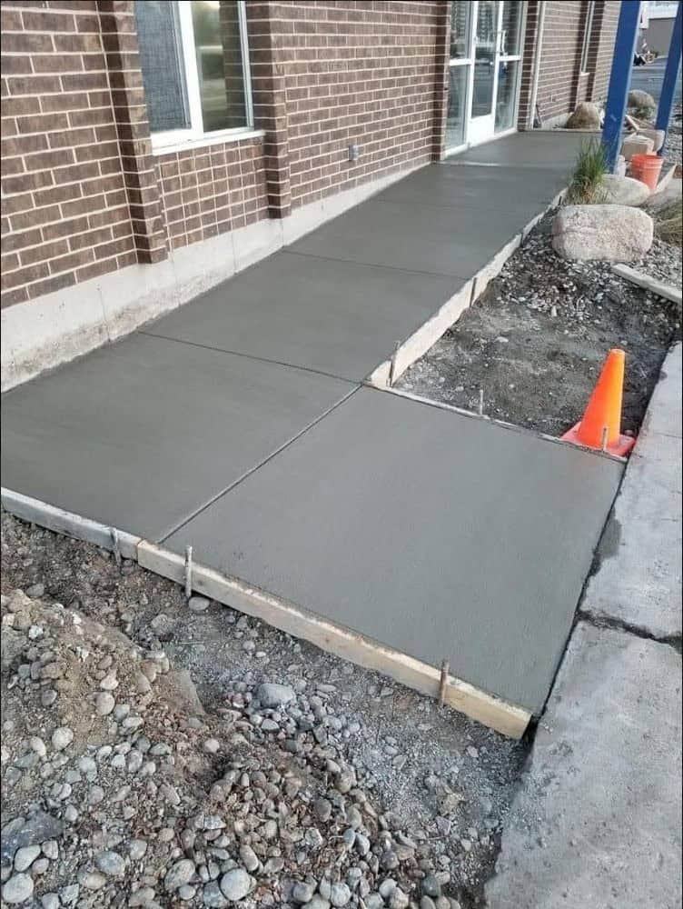 Garden pathway concrete installation - winding path through landscape