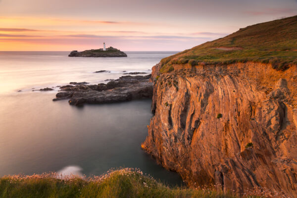 View over St Ives Bay to Godrevy Lighthouse from the cliffs at Godrevy, Cornwall. The lighthouse is said to have been the inspiration for Virginia Woolf's novel, To the Lighthouse.