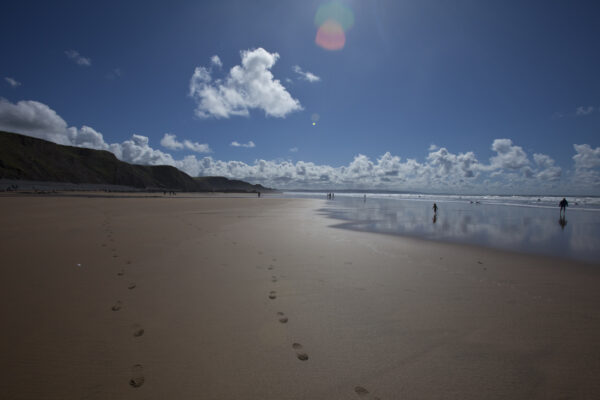 Walkers on the beach at Sandymouth, Cornwall. ©National Trust Images Chris Lacey