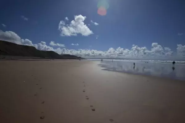 Walkers on the beach at Sandymouth, Cornwall. ©National Trust Images Chris Lacey