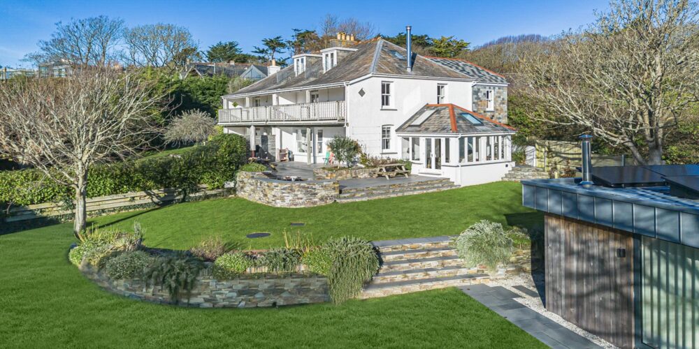 Charming Cornish seaside house with lush garden and scenic views, perfect for relaxing Cornwall holiday stays.