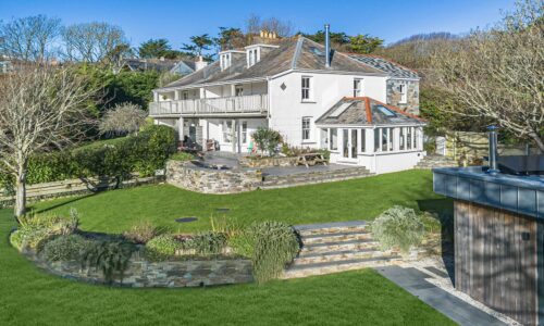 Charming Cornish seaside house with lush garden and scenic views, perfect for relaxing Cornwall holiday stays.