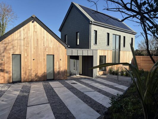 Modern eco-friendly house with solar panels in Cornwall.