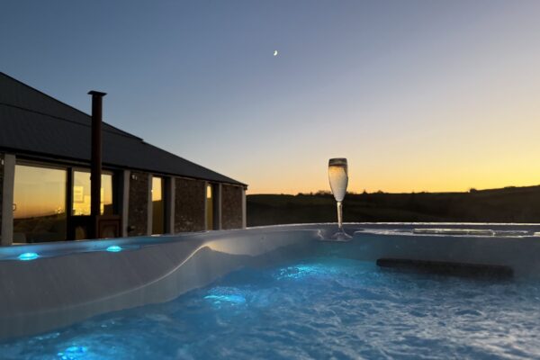 Relaxing hot tub with sunset views at Cornish Secrets.