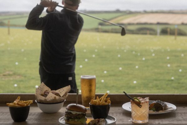Golfing at Halwyn with food and drinks on a sunny day.