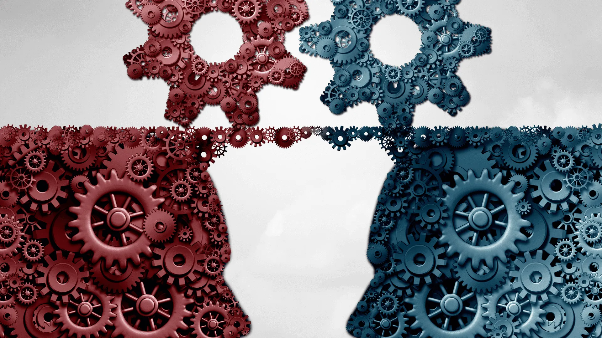 Rote und blaue Zahnräder, die in einer Verbindung dargestellt sind, symbolisieren Zusammenarbeit und Partnerschaft.