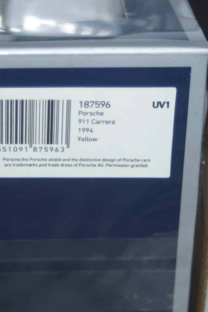 Norev  porsche 911 carrera coupe 1994 yellow 1:18 scale 187596