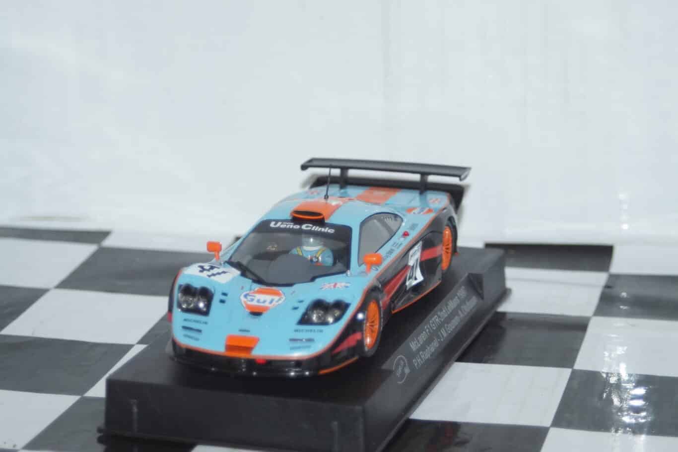 Slot.it mazda 787b white kit been painted black with orange wing mirrors and spoiler ca15z