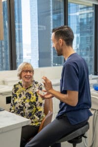 Dentist discussing Dental Implants Brisbane