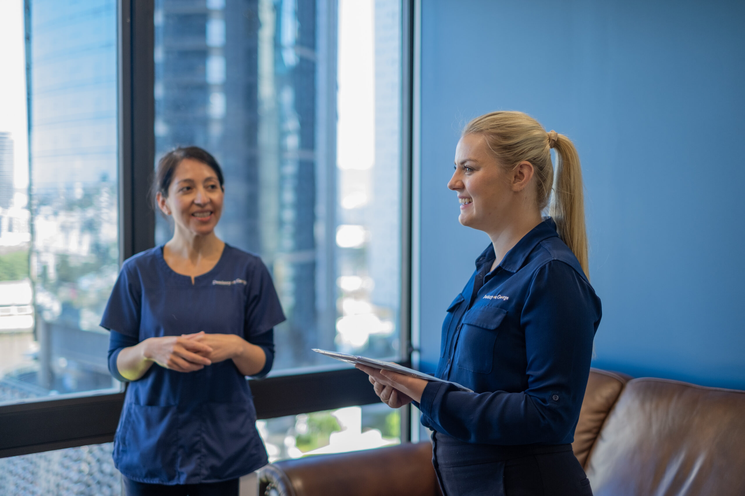 two dental staff planning their day at brisbane cbd dentist