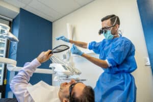 Dentist demonstrating flossing technique for preventative dentistry at a brisbane cbd dentist