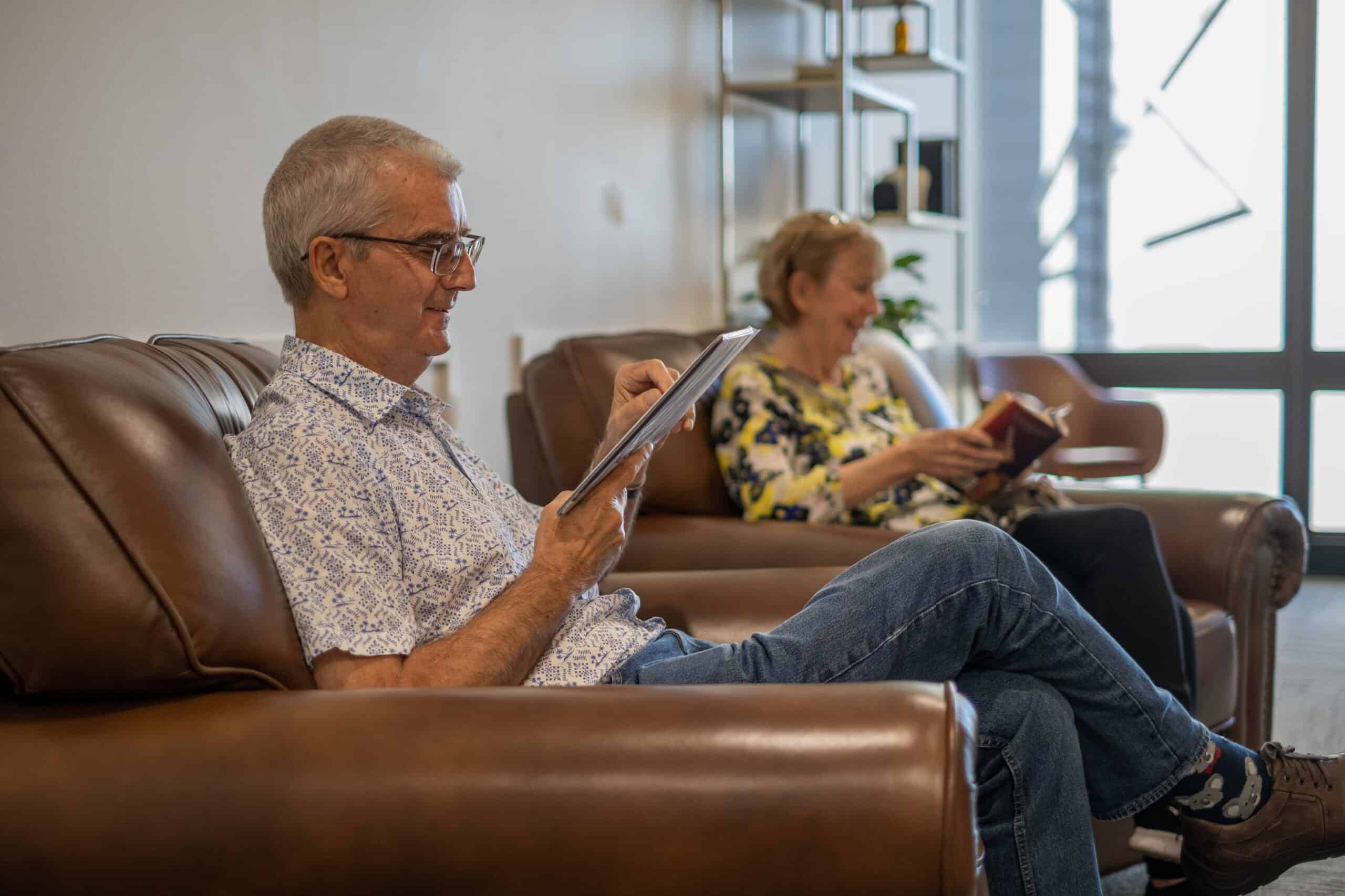 Dental patients filling out new patient forms in Brisbane CBD dental practice waiting room