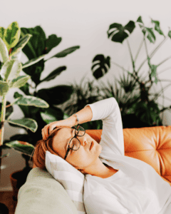 tired woman lying on a couch