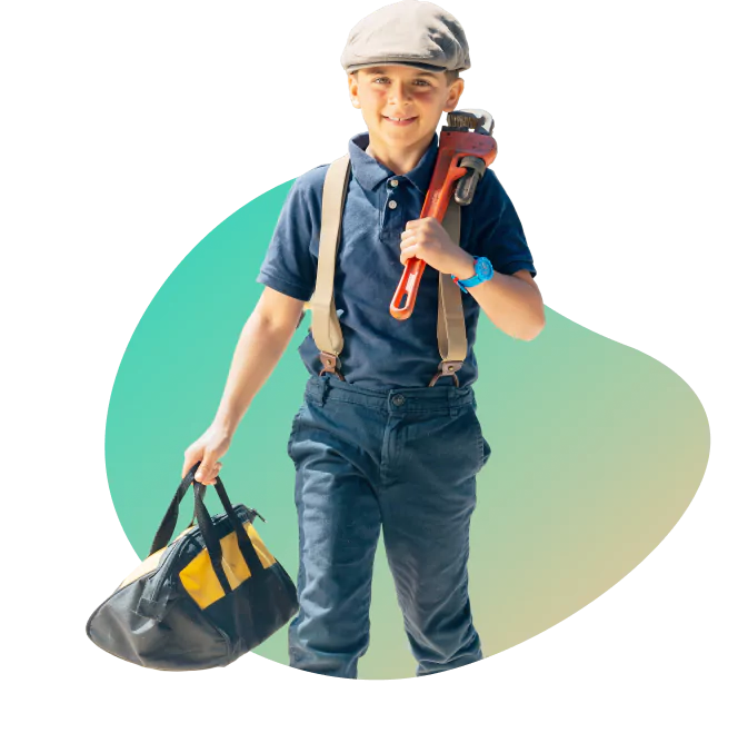 A young boy wearing a cap and suspenders holds a large wrench and a tool bag. He is dressed in a blue shirt and pants against a gradient background.