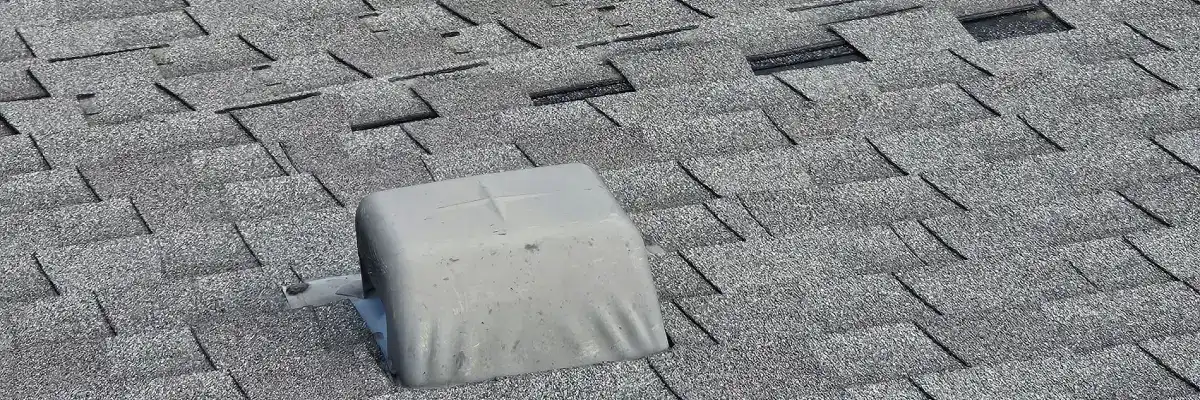 Close-up of cracked and curling roof shingles showing severe roof heat damage San Antonio by Dolan Roofing & Construction